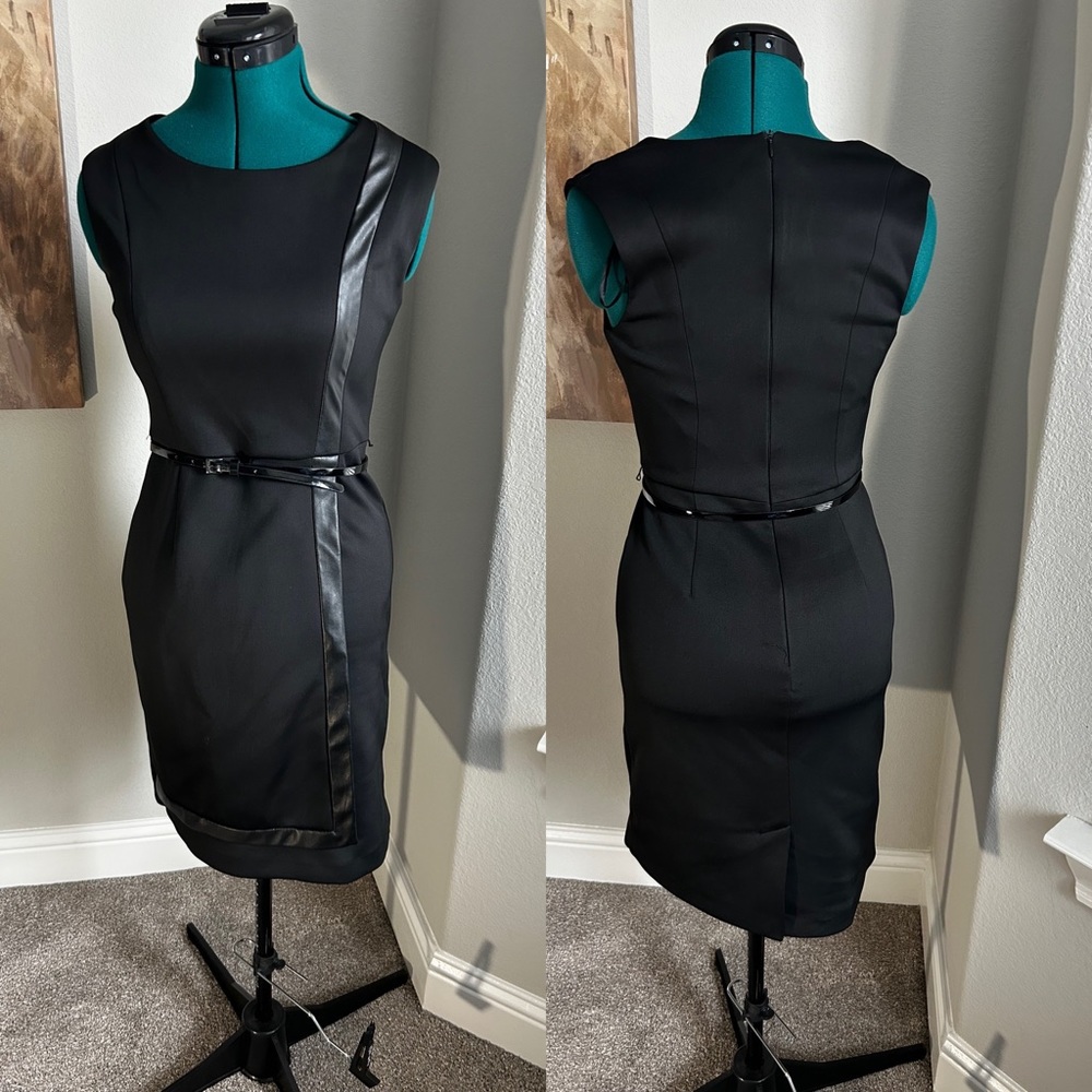 Black fitted dress with belt. Faux wrap style.